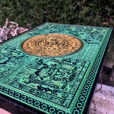 Handcrafted Aztec calendar in green tones, engraved on premium wood panel.