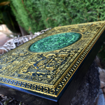 Detailed Mayan sun stone engraving, handcrafted wood Aztec wall decor.