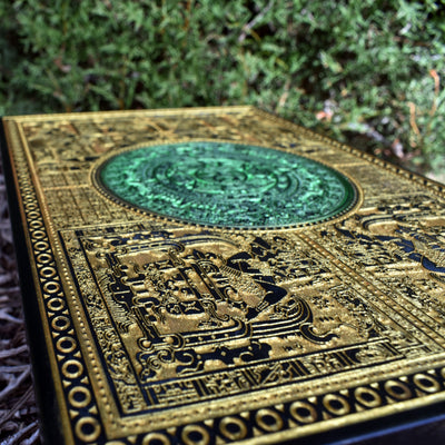 Aztec calendar wall plaque in gold and green, engraved on premium wood.