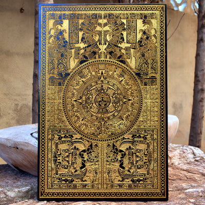 Laser-engraved Aztec calendar on solid wood, inspired by ancient Mayan sunstone.