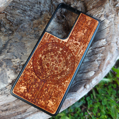 Aztec Calendar wooden phone case featuring detailed engraving, compatible with iPhone & Samsung Galaxy. Eco-friendly and durable design with intricate artwork.