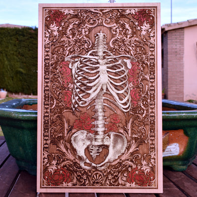 Hand-painted skeleton torso wall art with red flowers on carved wood panel.