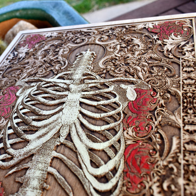 Skeleton torso with floral accents painted on wood, gothic home artwork.