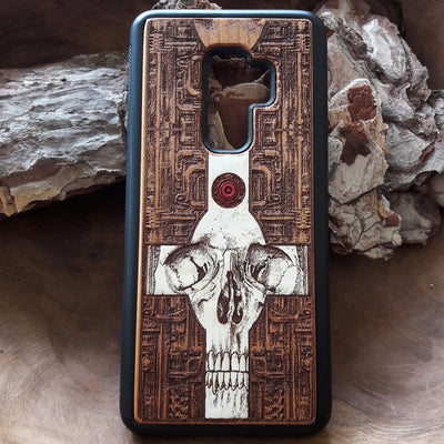 Laser-engraved wooden phone case featuring a gothic skull and cross design, compatible with iPhone 16, iPhone 15, Galaxy S25, and more
