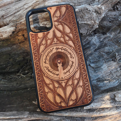 Wooden phone case featuring a Gothic Lord of the Rings-inspired design, with intricate laser-engraved patterns. The design includes dark, medieval-style elements with Elvish script, capturing the essence of Middle-Earth's dark aesthetic. Compatible with iPhone , 15, 14, 13, 12, 11 Pro Max Mini, and Samsung Galaxy S, S24, S23, S22, S21, S20 Ultra, Plus, and Note 20. A unique and protective accessory for Tolkien fans with a taste for Gothic style.