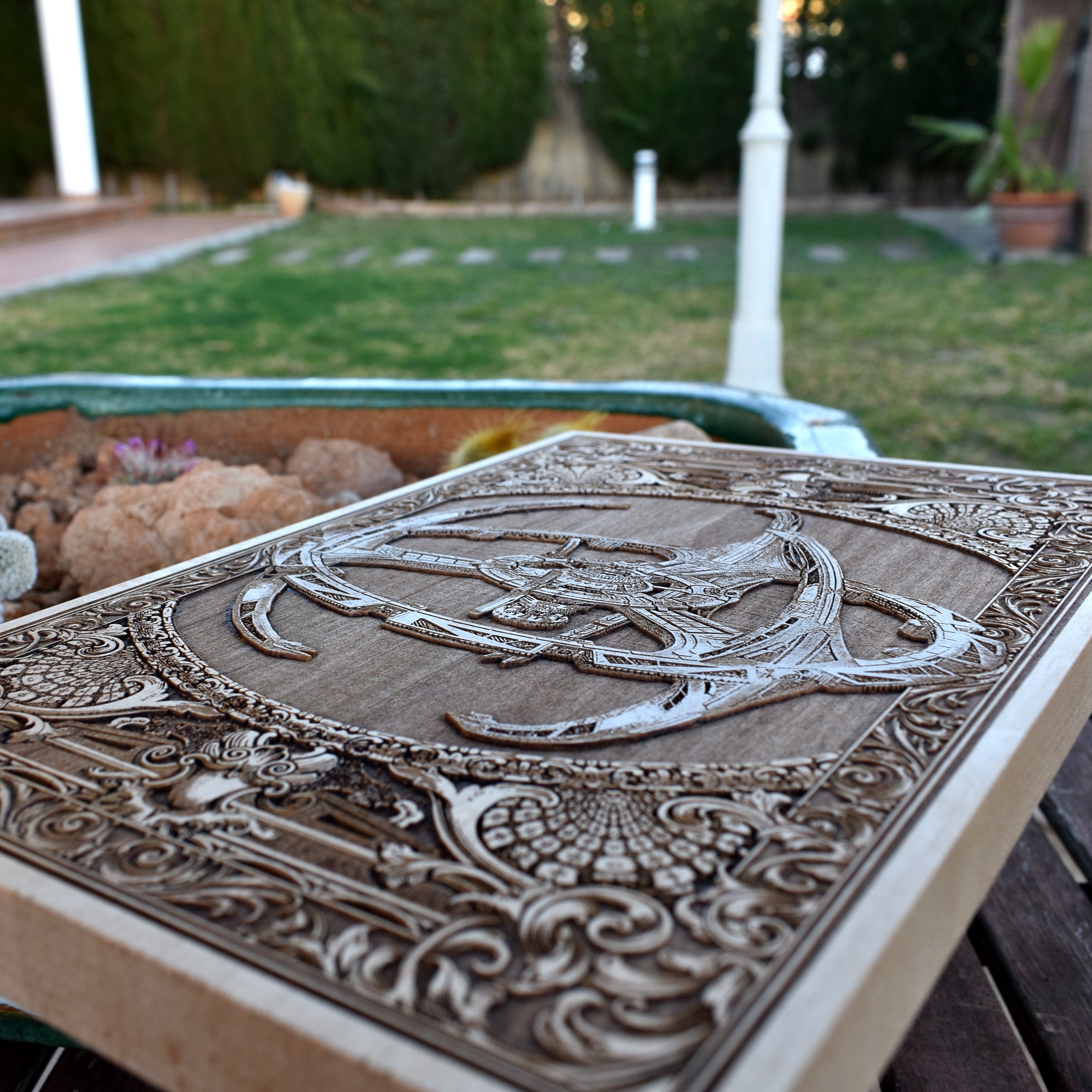 Original wood artwork of a futuristic spaceship with anatomical detailing.