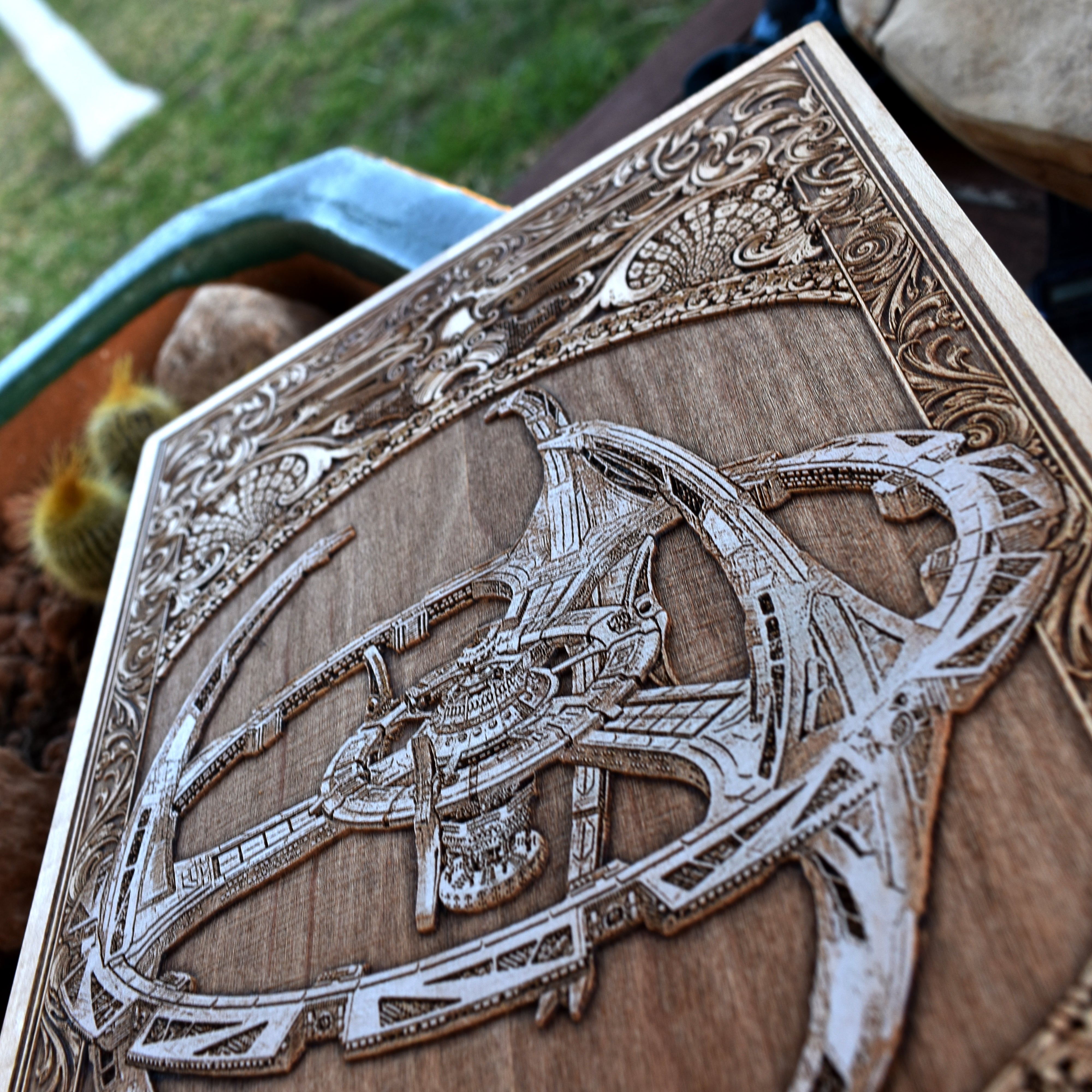 Sci-fi spaceship diagram painted on wood, perfect for space-themed decor.