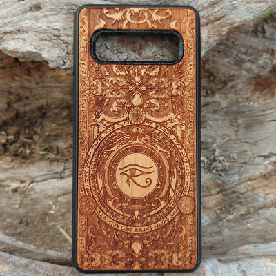 Handcrafted wooden phone case featuring the Eye of Ra symbol intricately engraved with ancient Egyptian-inspired detailing. Designed for iPhone , 15, 14, 13, 12, 11, Pro Max, Mini, and Samsung Galaxy S, S24, S23, S22, S21, S20 Ultra, Plus, Note 20 models. A unique fusion of art and protection for those who admire Egyptian mythology and premium craftsmanship.