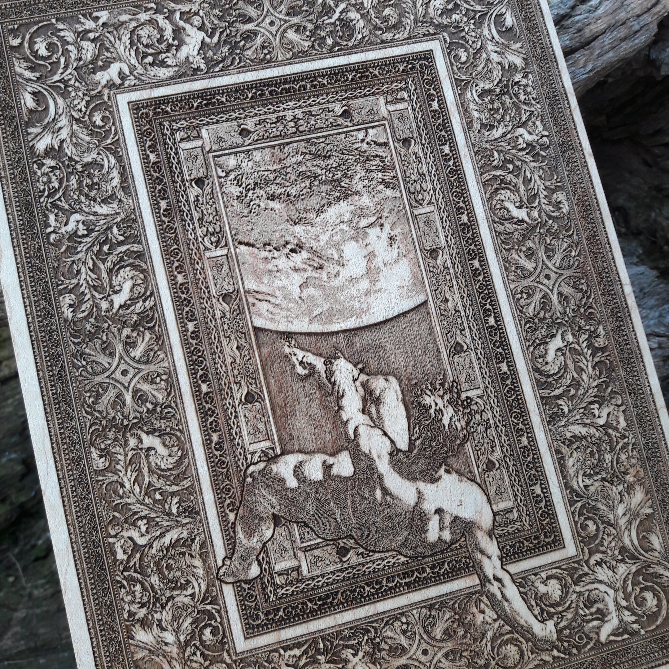 Greek mythology wood art – The Fall of Phaeton laser-engraved on wood with intricate detailing.