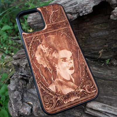 Wooden phone case featuring a detailed Bride of Frankenstein design, perfect for iPhone , Galaxy S, and other popular models. Ideal for horror and gothic fans looking for unique, artistic phone accessories.