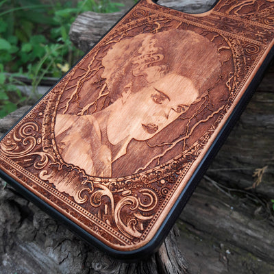 Wooden phone case featuring a detailed Bride of Frankenstein design, perfect for iPhone , Galaxy S, and other popular models. Ideal for horror and gothic fans looking for unique, artistic phone accessories.