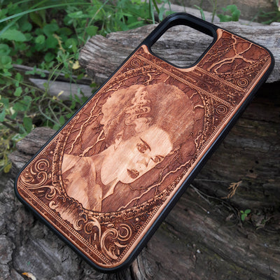 Wooden phone case featuring a detailed Bride of Frankenstein design, perfect for iPhone , Galaxy S, and other popular models. Ideal for horror and gothic fans looking for unique, artistic phone accessories.