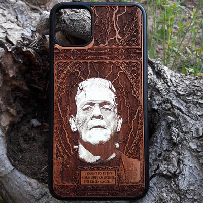 Laser-engraved Frankenstein's monster design on a wooden phone case, featuring the quote “I ought to be thy Adam, but I am rather the fallen angel...” Compatible with iPhone 16 and Samsung Galaxy S25.