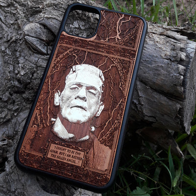 Laser-engraved Frankenstein's monster design on a wooden phone case, featuring the quote “I ought to be thy Adam, but I am rather the fallen angel...” Compatible with iPhone 16 and Samsung Galaxy S25.