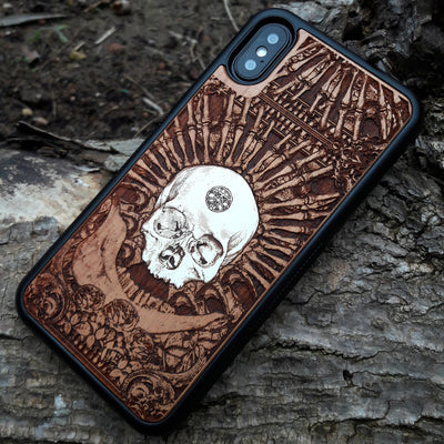 Laser-engraved wooden phone case featuring a detailed skull and cross design, compatible with Samsung Galaxy and iphone