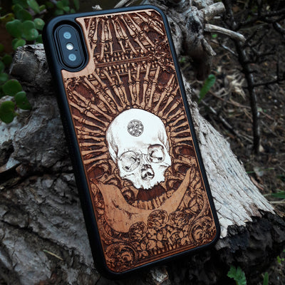 Laser-engraved wooden phone case featuring a detailed skull and cross design, compatible with Samsung Galaxy and iphone