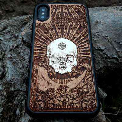 Laser-engraved wooden phone case featuring a detailed skull and cross design, compatible with Samsung Galaxy and iphone