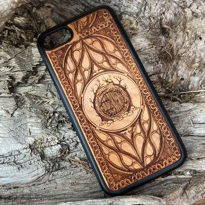 Lord of the Rings Hobbit Door wood phone case, laser-engraved with intricate detailing and decorative patterns. Crafted for durability and elegance, this case is compatible with iPhone , 15, 14, 13, 12, 11, Pro Max, Mini, and Samsung Galaxy S, S24, S23, S22, S21, S20 Ultra, Plus, Note 20. A perfect accessory for Tolkien fans seeking a unique and protective phone case.