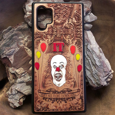 Laser-engraved horror-themed wooden phone case featuring a detailed skull design