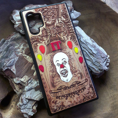 Laser-engraved horror-themed wooden phone case featuring a detailed skull design