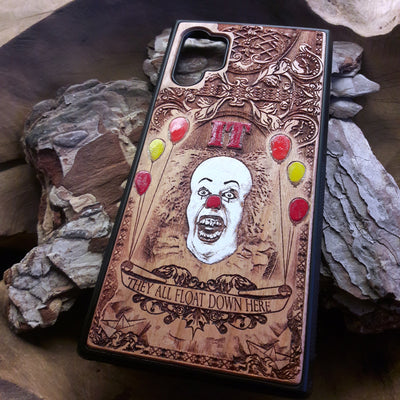 Laser-engraved horror-themed wooden phone case featuring a detailed skull design