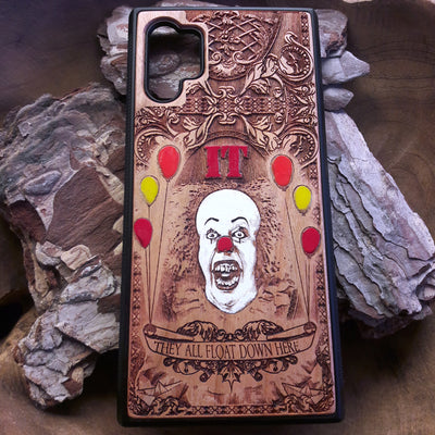 Laser-engraved horror-themed wooden phone case featuring a detailed skull design