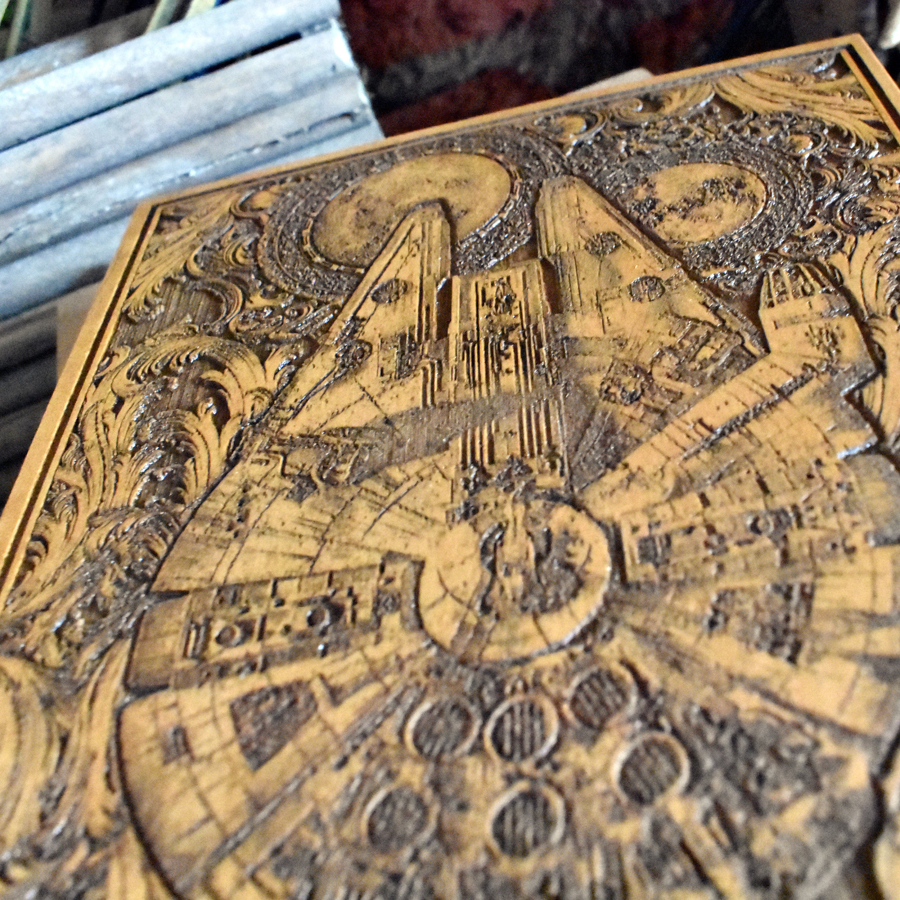 Geeky home decor featuring an intricately engraved Millennium Falcon wood panel