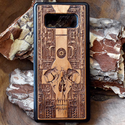 Wooden phone case with a detailed gothic skull design, laser-engraved for iPhone , iPhone 15, Galaxy S, Note 20, and more. A unique, durable accessory for fans of dark art.