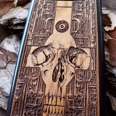 Wooden phone case with a detailed gothic skull design, laser-engraved for iPhone , iPhone 15, Galaxy S, Note 20, and more. A unique, durable accessory for fans of dark art.