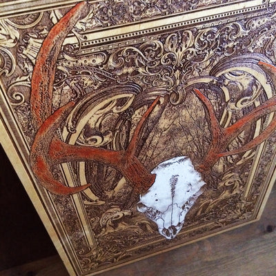 Deer skull wall art on handcrafted cedar wood, ideal for man caves.