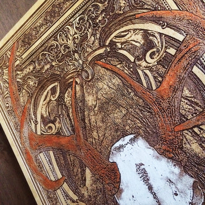 Gothic deer skull wood engraving with antlers, perfect lodge gift.