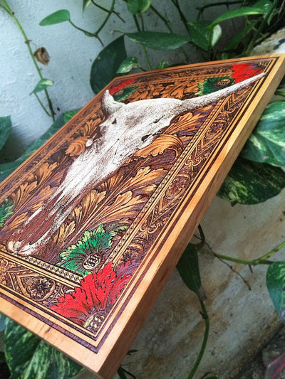 Cow skull rustic decor piece, engraved and hand-painted on wood.
