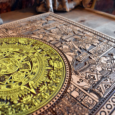 Mesoamerican Aztec calendar art, engraved and painted on wooden plaque.