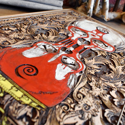 Handcrafted skull hourglass art with blood flow detail, engraved on cedar wood.