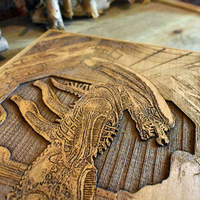 Xenomorph wood carving – detailed horror artwork for sci-fi collectors