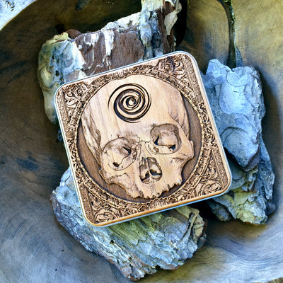 Detailed dark art skull engraving on wood wireless charger, unique gothic tech accessory for iPhone 16 and Galaxy S25 users.