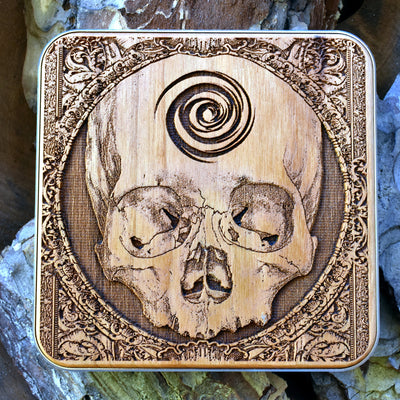 Handcrafted wooden wireless charger with engraved skull dark art, compatible with iPhone 16 and Galaxy S25, ideal for gothic home decor.