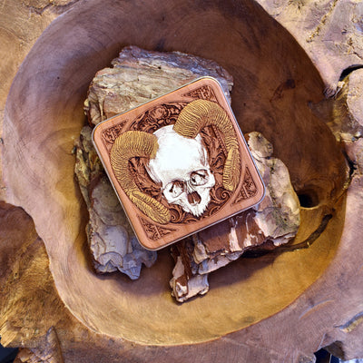 Detailed human skull engraving on dark wood wireless charger, ideal for horror fans using iPhone 16 or Galaxy S25.