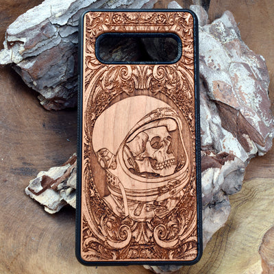 Wooden phone case with intricate engraved praying skeleton design, compatible with iPhone , iPhone 15, Samsung Galaxy S, Note 20, and more. Perfect for gothic art lovers and unique phone accessories.