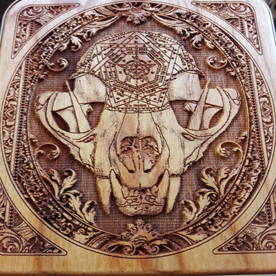 Wireless desk pad with engraved wood art, offering fast Qi charging and artistic desk organization.