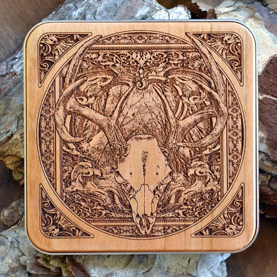 Handmade wooden wireless charger featuring deer skull dark art engraving, ideal for gothic spaces.