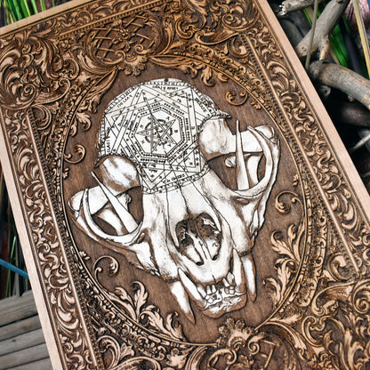 Gothic cat skull wall art engraved and painted on wood, eerie and unique.