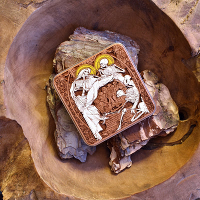 Side view of hand-painted Human Souls dark art wireless charger with Gothic skull art for iPhone & Galaxy