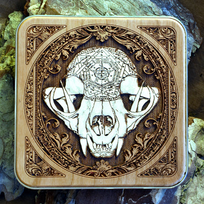Handmade wood wireless charger with cat skull dark art engraving, perfect for gothic interiors.