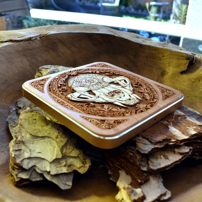 Slim wooden wireless charger featuring bold cat skull engraving, combining function with gothic style.