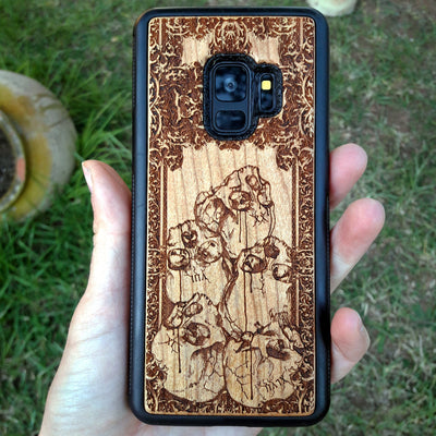 Wooden phone case with intricately carved skull design, ideal for iPhone , Samsung Galaxy S, Note 20, and more. A unique gothic accessory offering durable protection with artistic detail.