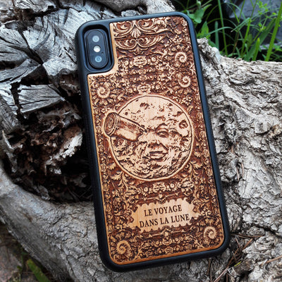 Wooden phone case with detailed laser engraving of 'A Trip to the Moon' design, available for iPhone , iPhone 15, Galaxy S, Note 20, and other models. Perfect for vintage movie fans and space enthusiasts.