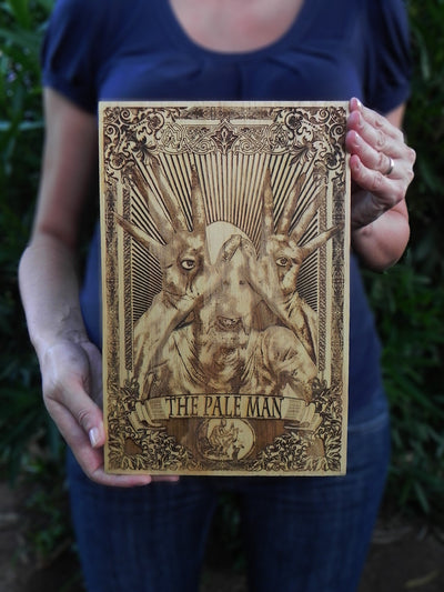 Handcrafted wooden Pale Man plaque, perfect for horror movie fans