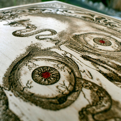 Gothic horror skull art with octopus tentacle engraving