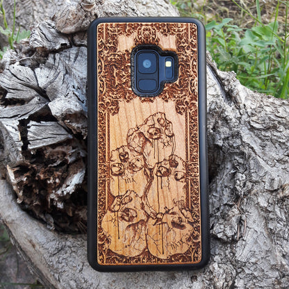Wooden phone case with intricately carved skull design, ideal for iPhone 16, Samsung Galaxy S25, Note 20, and more. A unique gothic accessory offering durable protection with artistic detail.